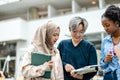 Group of multiethnic students in a library Royalty Free Stock Photo