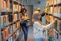 Group of multiethnic students in a library Royalty Free Stock Photo