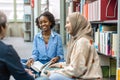 Group of multiethnic students in a library Royalty Free Stock Photo