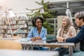 Group of multiethnic students in a library Royalty Free Stock Photo