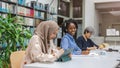 Group of multiethnic students in a library Royalty Free Stock Photo