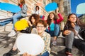 Cute teens with colorful empty speech bubbles Royalty Free Stock Photo