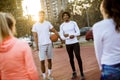 Group of multiethnic young people playing basketball on court Royalty Free Stock Photo