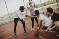 Multiethnic young people playing basketball on court Royalty Free Stock Photo