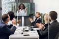 Group of multiethnical healthcare workers with digital tablets and laptop meeting in hospital boardroom. Medical staff Royalty Free Stock Photo