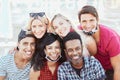 Group of multiracial friends taking a picture while focusing the camera and smiling with face mask - New lifestyle concept