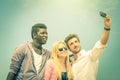 Group of multiracial happy best friends taking a vintage selfie Royalty Free Stock Photo