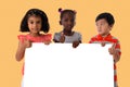 Group of multiracial kids portrait with white board.