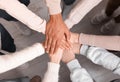 Group of multiracial people joining hands together indoors, top view Royalty Free Stock Photo
