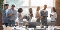 Group of multiracial young people sharing ideas while coffe break Royalty Free Stock Photo