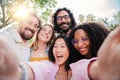 Group of multiracial young people smiling and taking a selfie together. Close up portrait of happy asian teenage woman Royalty Free Stock Photo