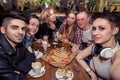 Selfie time. Handsome friends making selfie and smiling while resting at pub. Royalty Free Stock Photo