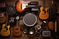 Group of musical instruments including a guitar, drum, keyboard, tambourine. Top view Royalty Free Stock Photo