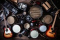 Group of musical instruments including a guitar, drum, keyboard, tambourine. Top view Royalty Free Stock Photo