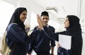 A group of Muslim students doing hi-5 Royalty Free Stock Photo