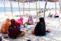A group of muslim women enjoying lunch on the beach Royalty Free Stock Photo