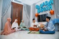 group of Muslims reading Al-Quran during Quran recitation