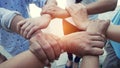 Group of new generation hands together expressing positive , tea