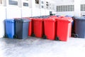 Group of new large colorful wheelie bins for rubbish, recycling waste