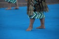 Group of New Zealand Maori folk dancers performing in an outdoor festival. Royalty Free Stock Photo