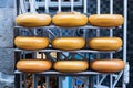 Nine round gouda cheeses stacked outside a cheese factory store in Amsterdam, Netherlands Royalty Free Stock Photo