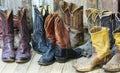 A Group of Nine Pairs of Old Cowboy Boots