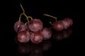 Rose wine grape isolated on black glass