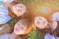 Group o beautiful girl are laying on the sunny glade with smail an Royalty Free Stock Photo