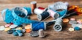 Group of objects about Sewing equipment set on a wooden background. Sewing and tailoring concept. Royalty Free Stock Photo