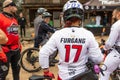 Group of off-road motorcyclists are seen riding their dirt bikes on a winding dirt track