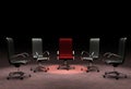 A group of office chairs representing the concepts of leadership, stand out from the crowd, different