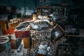 Group of old antique retro television or broken TV boxes in dark creepy abandoned house among garbage in dirty room