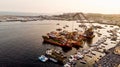 Group of Old Cargo Ships, Tugboats, Fishing Ships and Small Boats in the Coast near Rocks. Royalty Free Stock Photo