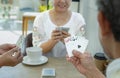 group of old pensioners playing cards at home Royalty Free Stock Photo