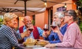 Group of old people eating and drinking outdoor - Senior couples having fun together Royalty Free Stock Photo