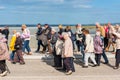 Group of old people visiting Mont Saint Michel monastery Royalty Free Stock Photo