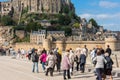 Group of old people visiting Mont Saint Michel monastery Royalty Free Stock Photo