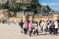 Group of old people visiting Mont Saint Michel monastery