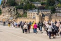 Group of old people visiting Mont Saint Michel monastery Royalty Free Stock Photo