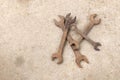 Copy space group old rusted spanner wrenches Mechanic tool on grey concrete background