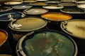 Group of old rusting metal drums