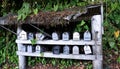 A group of old rusty and weather damaged mail boxes