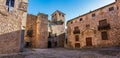 A group of old stone houses in the medieval town of Caceres, Spain.