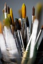 Group of old used paintbrushes in jar. Royalty Free Stock Photo