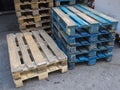 Group of old wooden pallet stacked outside wharehouse