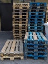 Group of old wooden pallet stacked outside wharehouse