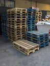 Group of old wooden pallet stacked outside wharehouse