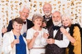 Older happy friends toasting with champagne during New Year`s Eve Royalty Free Stock Photo