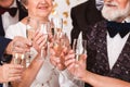 Older happy friends toasting with champagne during New Year`s Eve Royalty Free Stock Photo