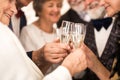 Older happy friends toasting with champagne during New Year`s Eve Royalty Free Stock Photo